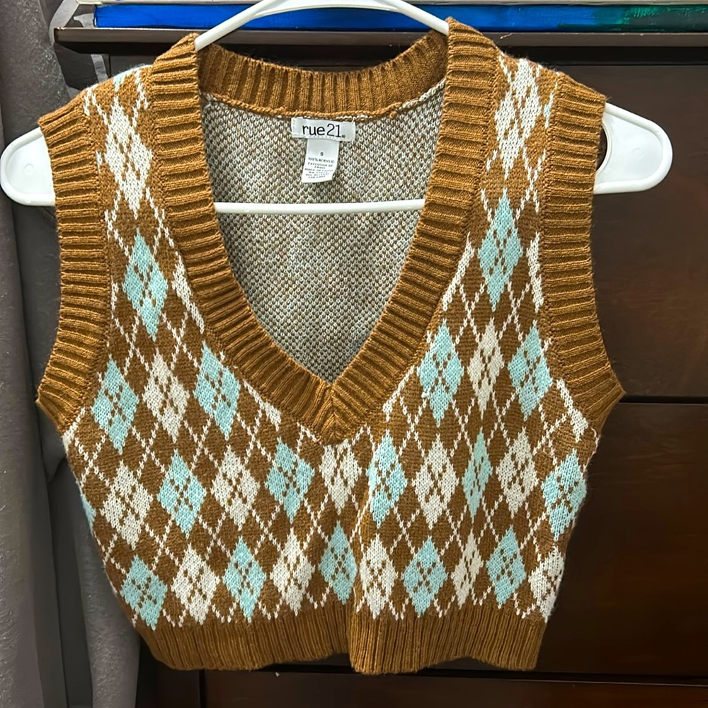 This is a waist length, v neck sweater.